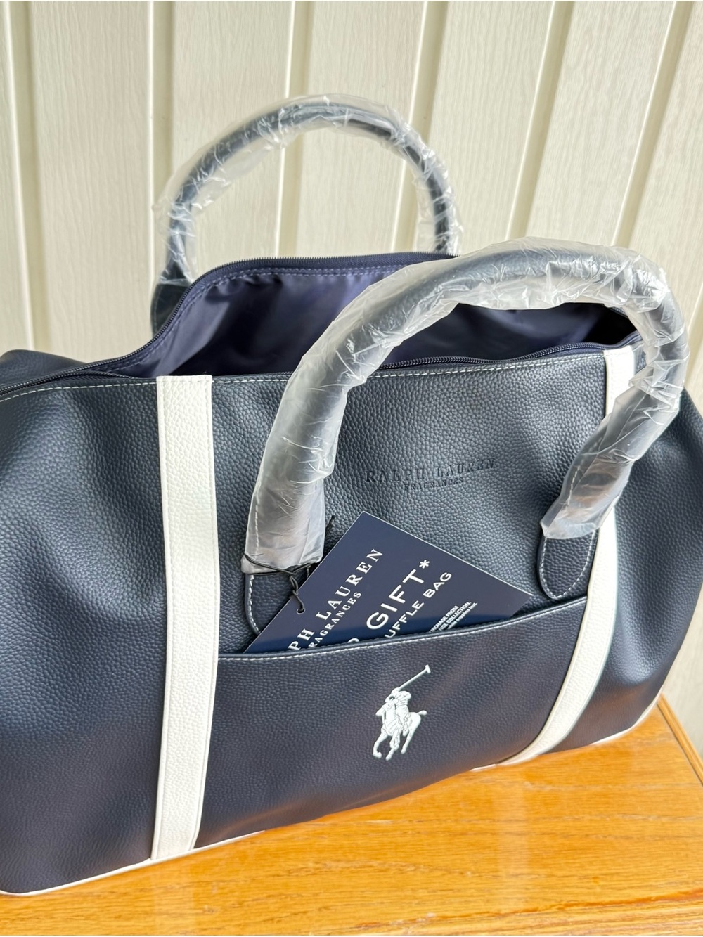 NWT.  Ralph Lauren Navy with White Trim Faux Leather Travel
Weekend Duffel Bag
